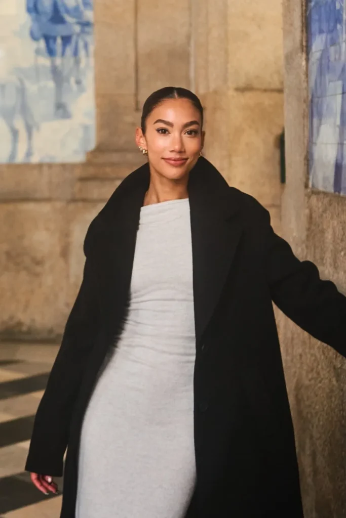 Journalist and travel creator Jenzia Burgos at the São Bento Train Station in Porto, Portugal