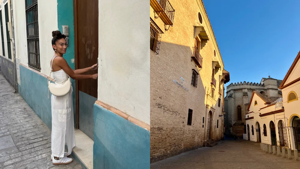 Split image of Jenzia standing at a teal-painted doorway on a narrow street in Sevilla's Feria neighborhood, wearing white wide-leg pants and a white tank top; right side shows the sunlit Plaza Calderón de la Barca with golden stone buildings and a clear blue sky